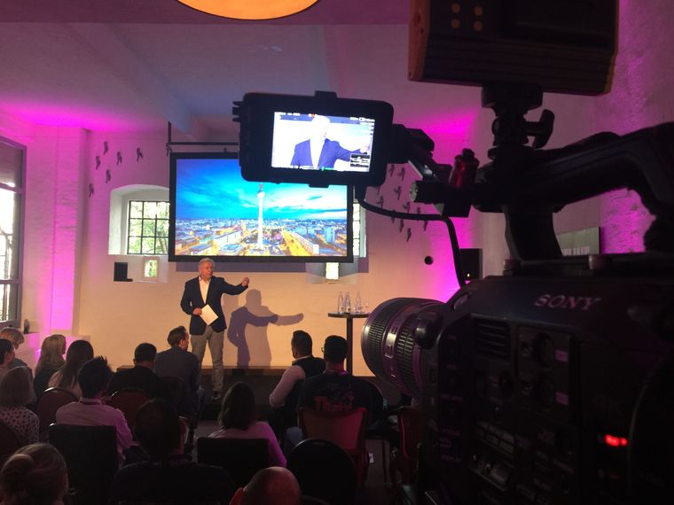 Filming a speaker at a conference