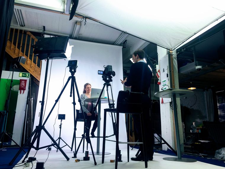 Studio interview against a white cyclorama